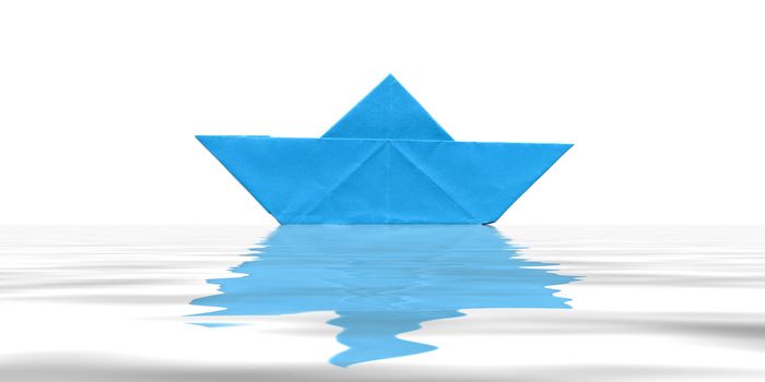 Toy paper boat over blue water background