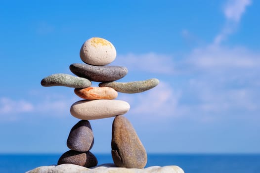 Figurine from color gravel on the sea coast