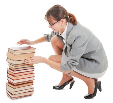 business woman  in spectacles and a pile of books