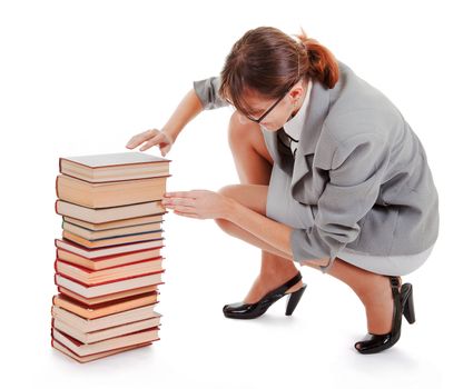 business woman  in spectacles and a pile of books