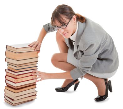 business woman  in spectacles and a pile of books