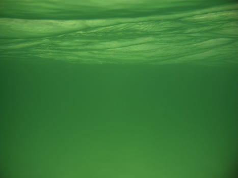 Here I`m sitting on the seabed, 2 m below the surface, taking the picture up towards the surface of the sea. The picture is taken at one of Karmøys (Norway) sandy beaches, summer 2008