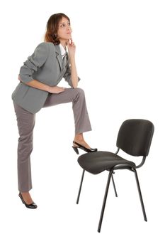 young girl in a gray business suit on white background