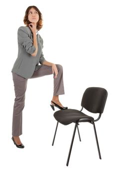 young girl in a gray business suit on white background