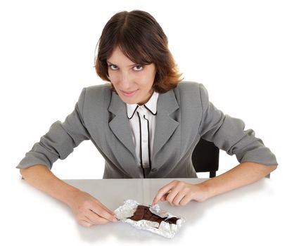 young girl with a chocolate bar in hand on a white background