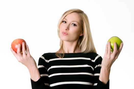 Healthy Choices.  A woman holding a red and green apple in her hands.