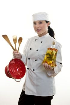 A kitchen hand or chef holding some common utensils