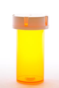 Empty prescription vial on white background.