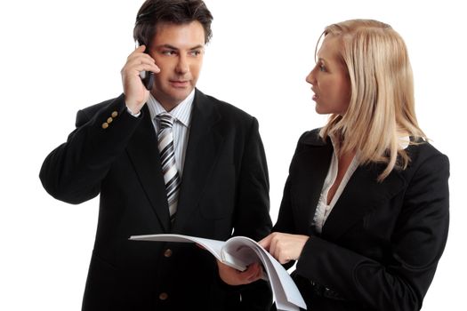 Business people discuss or make enquires or decision regarding a report, contract or other document.