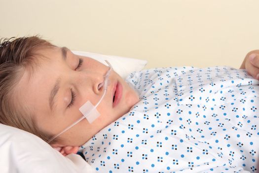 Sick child with nasal cannula.   a nasal cannula deliver from 24% to 40% oxygen at a flow rate of 0.26-1.58 gal (1-6 L) per minute.  Used for patients suffering respiratory disease, cardiac disease, shock, trauma, severe electrolyte imbalance (hypokalemia), low hemoglobin or severe blood loss, and seizures.   Facts:vEncyclopedia of Nursing & Allied Health 2002.