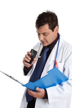A doctor recording or dictating information from a patient medical consultation file or could be recording observations of treatment.