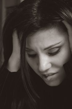 A woman shows angst, stress, worry,apprehension, overwork, business or financial woes.
