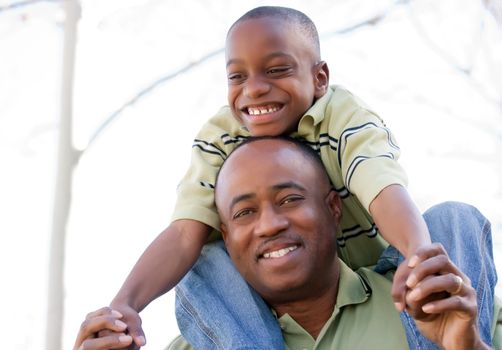 African American Man and Child Having Fun in the Park.