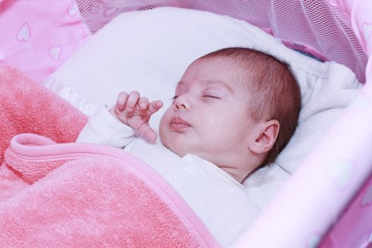 Baby sleeping in his crib