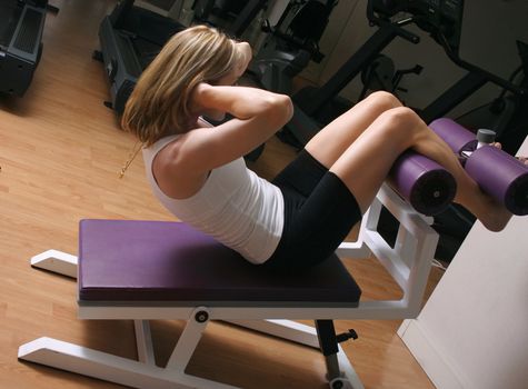 Woman using fitness machinery