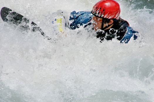 A man and kayak are swallowed up in whitewater