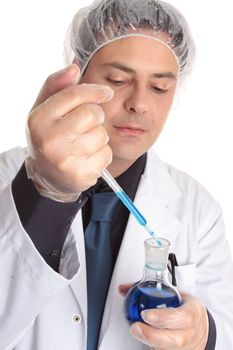 Scientist or lab worker at work using a disposable pipette taking or adding a liquid sample from round flat bottom flask