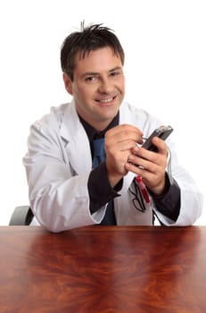 A doctor sitting at desk is using a pda