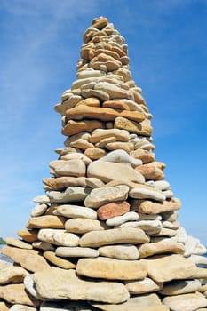 High pile of cobblestone against the blue sky