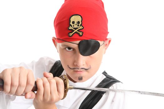Child play acting a Pirate.  He is wearing an eye patch, wielding a sword and has a mean stare.  eg theatre, costume, halloween.