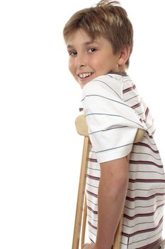 Side view boy using crutches.