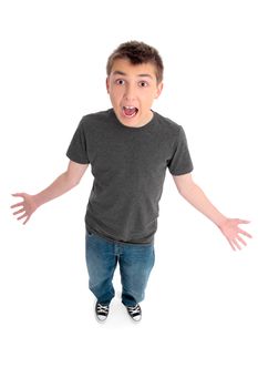 A boy standing on a white background.  He is wearing blue jeans and a plain dark grey marle t-shirt top.  He has his hands outstretched and is screaming or yelling expressive.