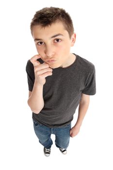 A thinking boy looking up.  He is standing and wearing casual clothes.