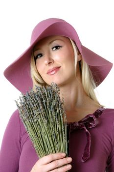 Woman with a bunch of dried lavender.  Originally found in the Mediterranean countries, the  herb lavender, has long been used for it�s perfume and medicinal qualities. The ancient Romans used it for healing and antiseptic qualities.  The name itself comes from the Latin "lavare" to wash. 

