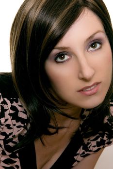 Portrait of a woman with brunette hair and brown eyes looking up