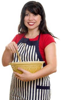 A woman in apron with mixing bowl and wooden utensil