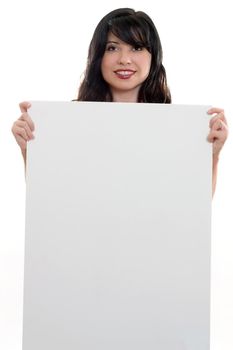 A woman with blank sign ready for text or imagery.
eg advertising, sales, endorsement, marketing, protest, 