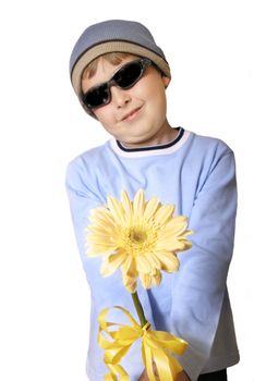 A boy with large creamy yellow gerbera.

