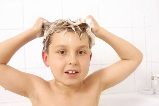 Young boy child with shampoo in his hair 