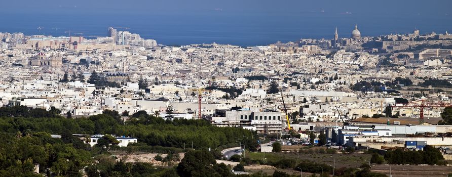 View of Malta as seen from Mdina bastions with plane on final descent to Luqa Airport