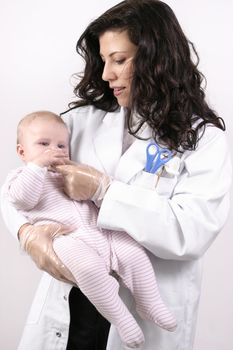 Nurse medicating a sick baby girl