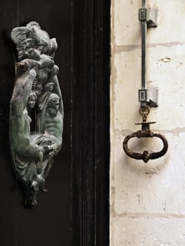 Old bronze door knocker in the ancient city of Mdina in Malta
