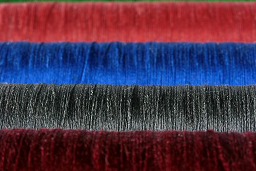 Threads for an embroidery in the sewing industry as a background.
