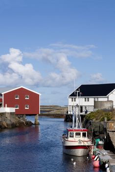 Fishing boat moored to the wharf in idyllic Veiholmen, Smola, western Norway