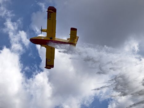 LUQA, MALTA - SEP 26 - Canadair CL-415 or Bombardier 415 or Super Scooper dropping water during the Malta International Airshow 26th September 2009