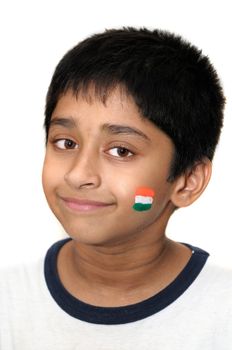 An handsome Indian kid smiles with his country flag painted on his cheek