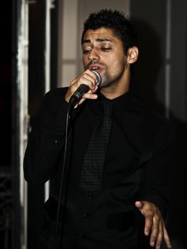 ST JULIANS, MALTA - AUG 28 - Singer Glen Vella performing during a private function on 28th August 2009