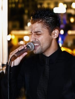 ST JULIANS, MALTA - AUG 28 - Singer Glen Vella performing during a private function on 28th August 2009