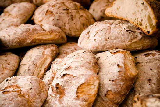 Heap of fresh bread. Shallow focus.