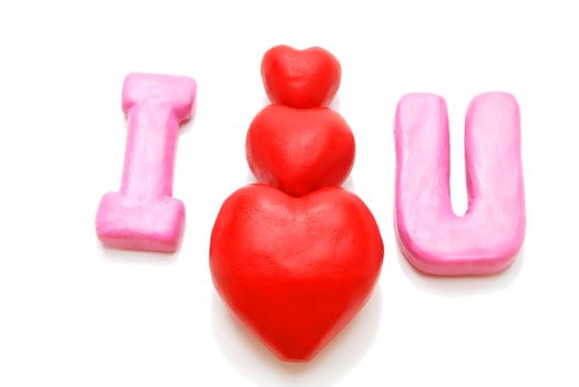 Valentine's I Love You Text with Pyramid of Hearts Made of Red and Pink Plasticine Isolated on White Background