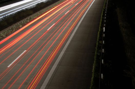 highway at night with car traffic and lights