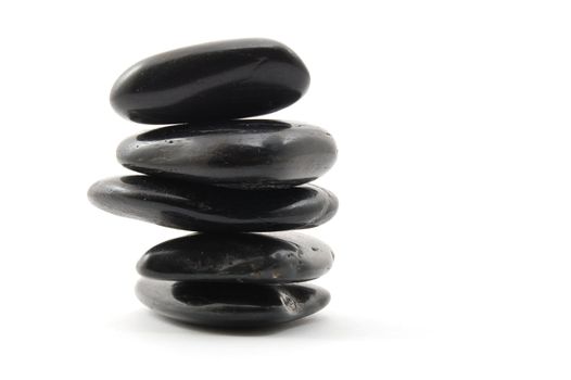 black stones in balance isolated on white background