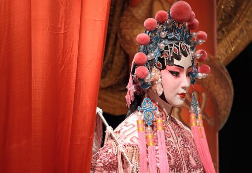 chinese opera dummy and red cloth as text space ,it is a toy,not real man 