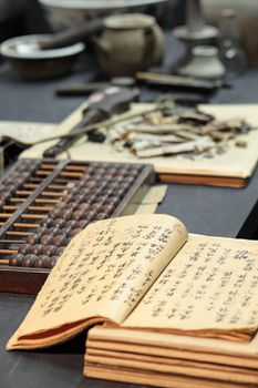abacus and book on the table in a chinese old shop