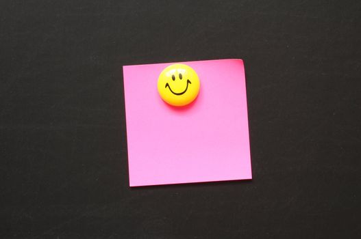 smiley and blank sheet note paper with copyspace