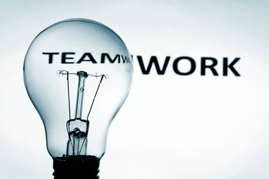 bulb and teamwork text showing concept of teamwork team and help in business